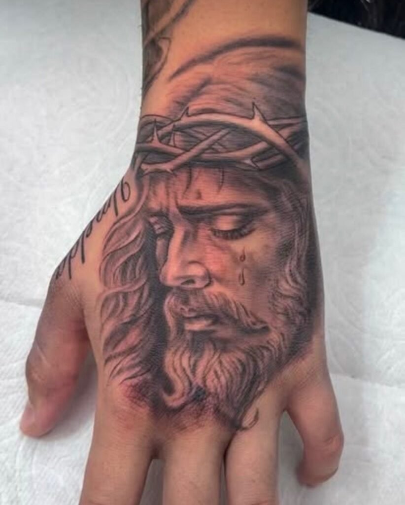 Black and grey Jesus hand tattoo by Monique Andujo