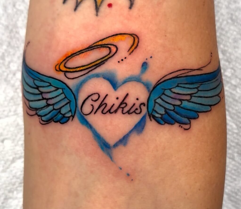 Blue angel wing heart with halo tattoo by Monique Andujo, Murrieta CA