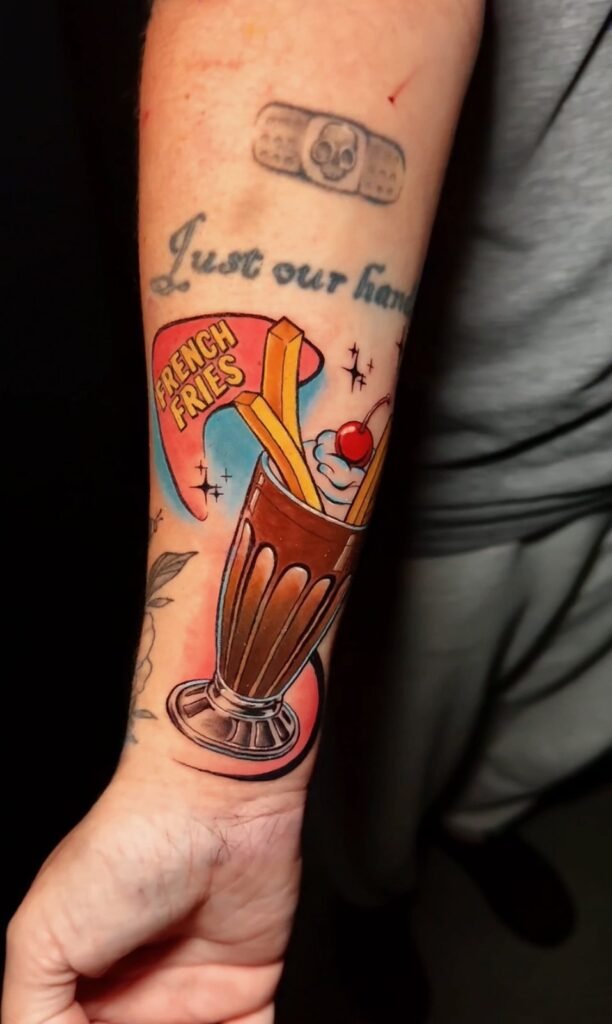Color milkshake and french fries forearm tattoo by Monique Andujo